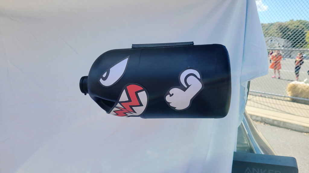 Diy Bullet Bill for trunk or treat made by spray painting an empty vinegar bottle.