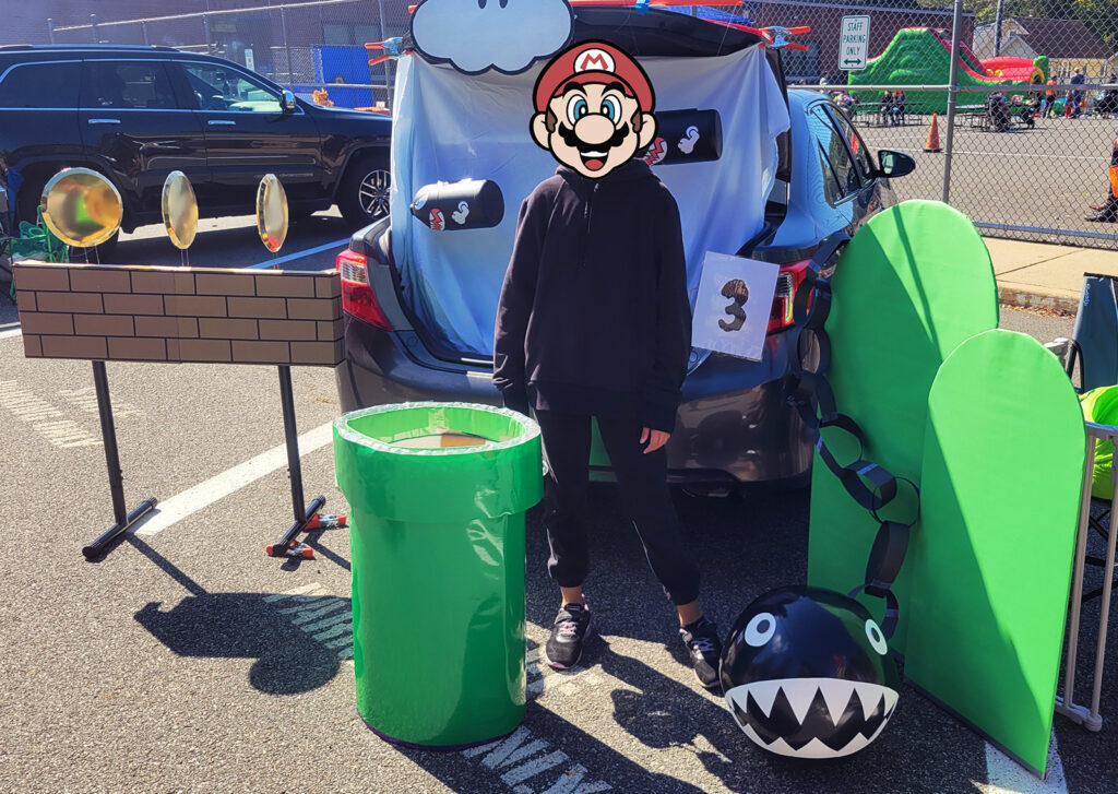 Final Super Mario DIY Trunk or Treat Display with Coins, hills, pipe, bullet bill etc.