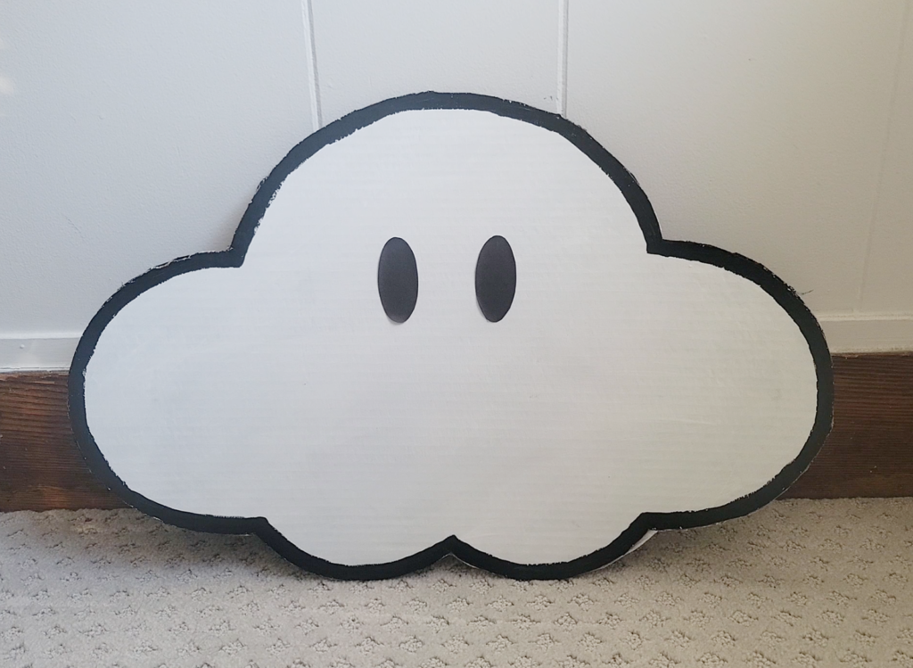 Super Mario cloud made of cardboard, white paint, black paint and paper eyes
